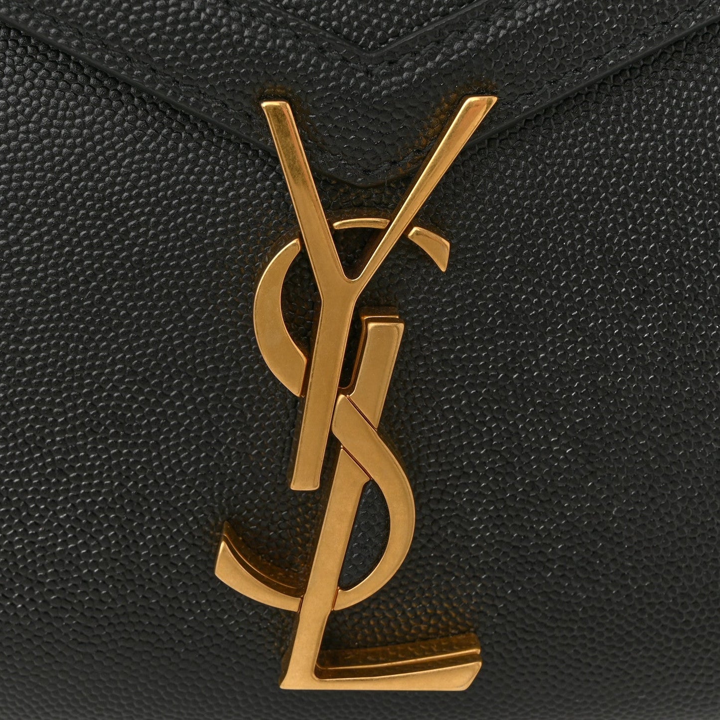 Gold YSL monogram logo on black textured leather flap.