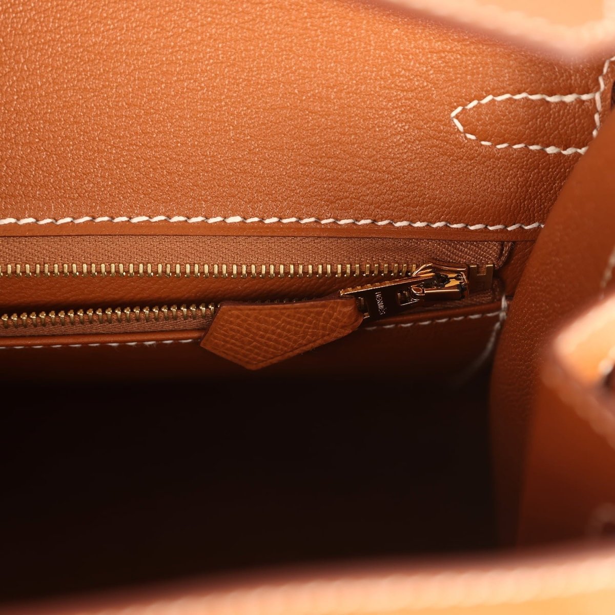 Hermes Birkin Sellier 25 handbag interior close-up of zipper track and leather tab