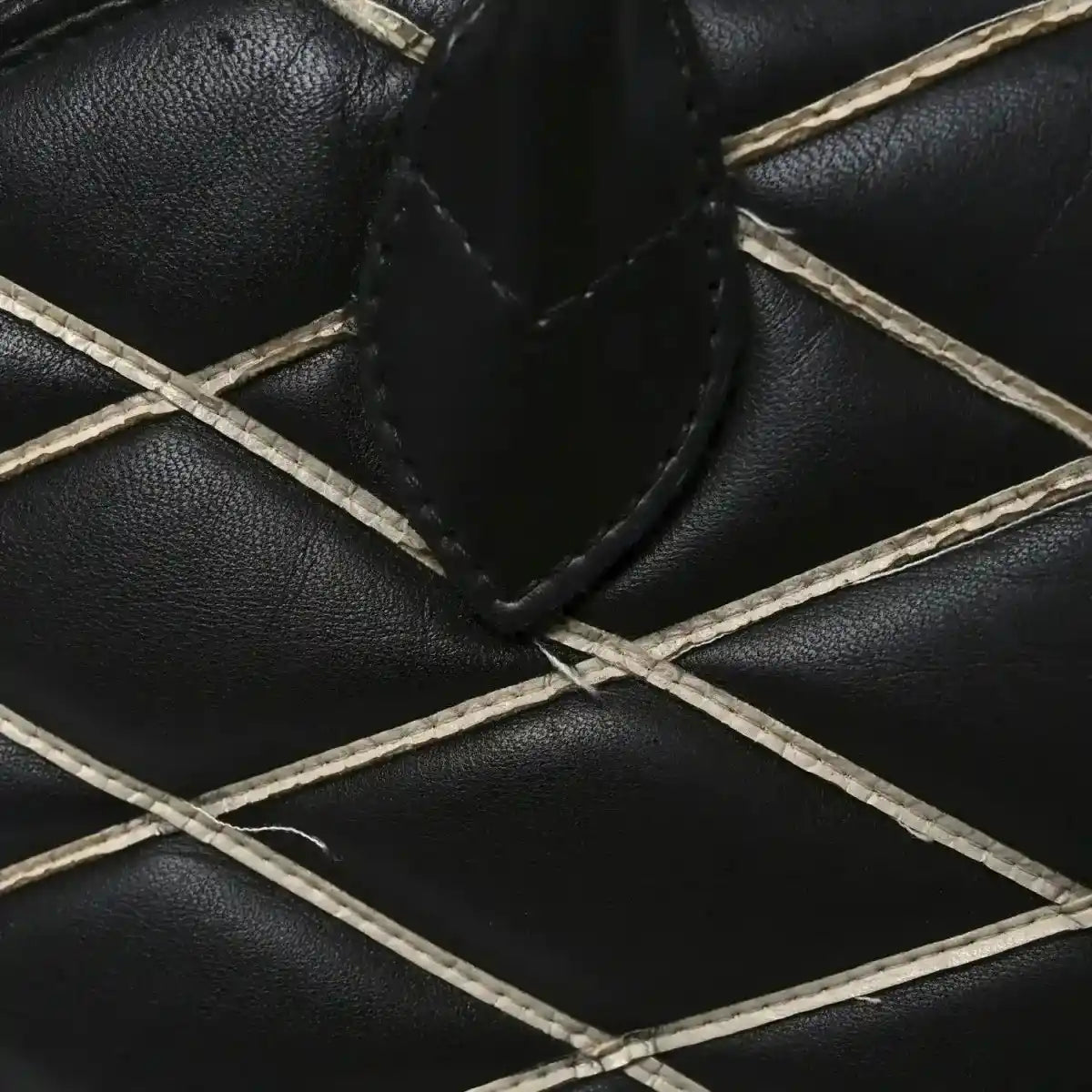 Black quilted lambskin lattice with white leather trim stitching
