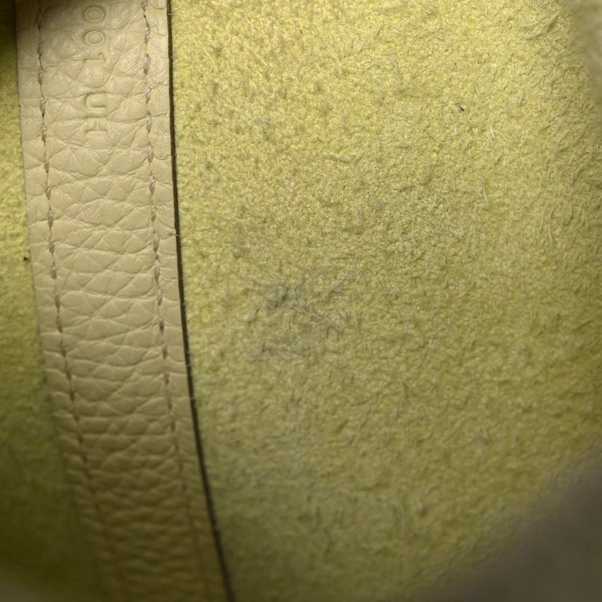 Two-tone calfskin handbag, close-up side panel with textured leather