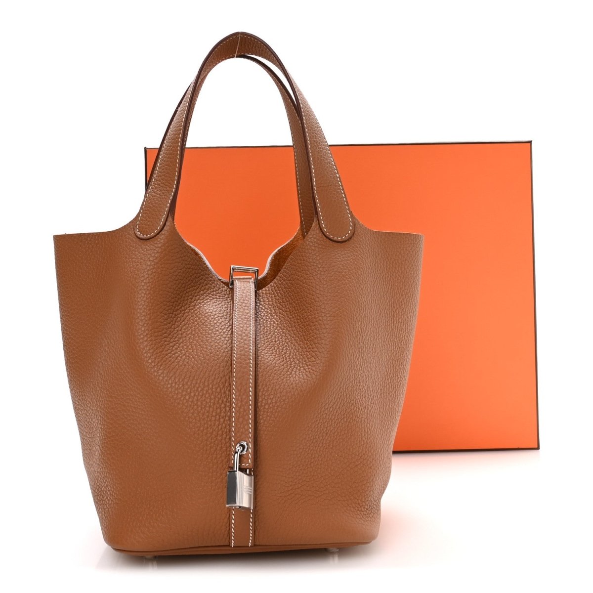 Tan leather mini tote with dual handles and front lock closure