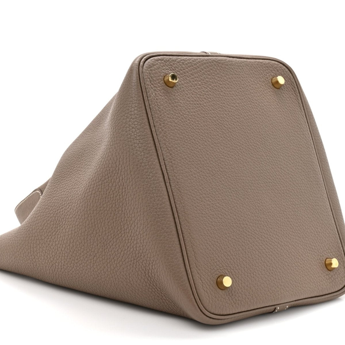 Taupe leather tote bag angled view with gold lock and structured sides