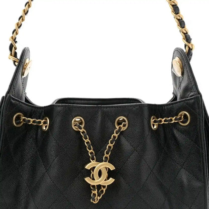 Black quilted mini handbag with chain handle, CC charm, and metal hardware