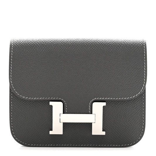Constance slim wallet front in dark textured leather with H clasp and contrast stitching