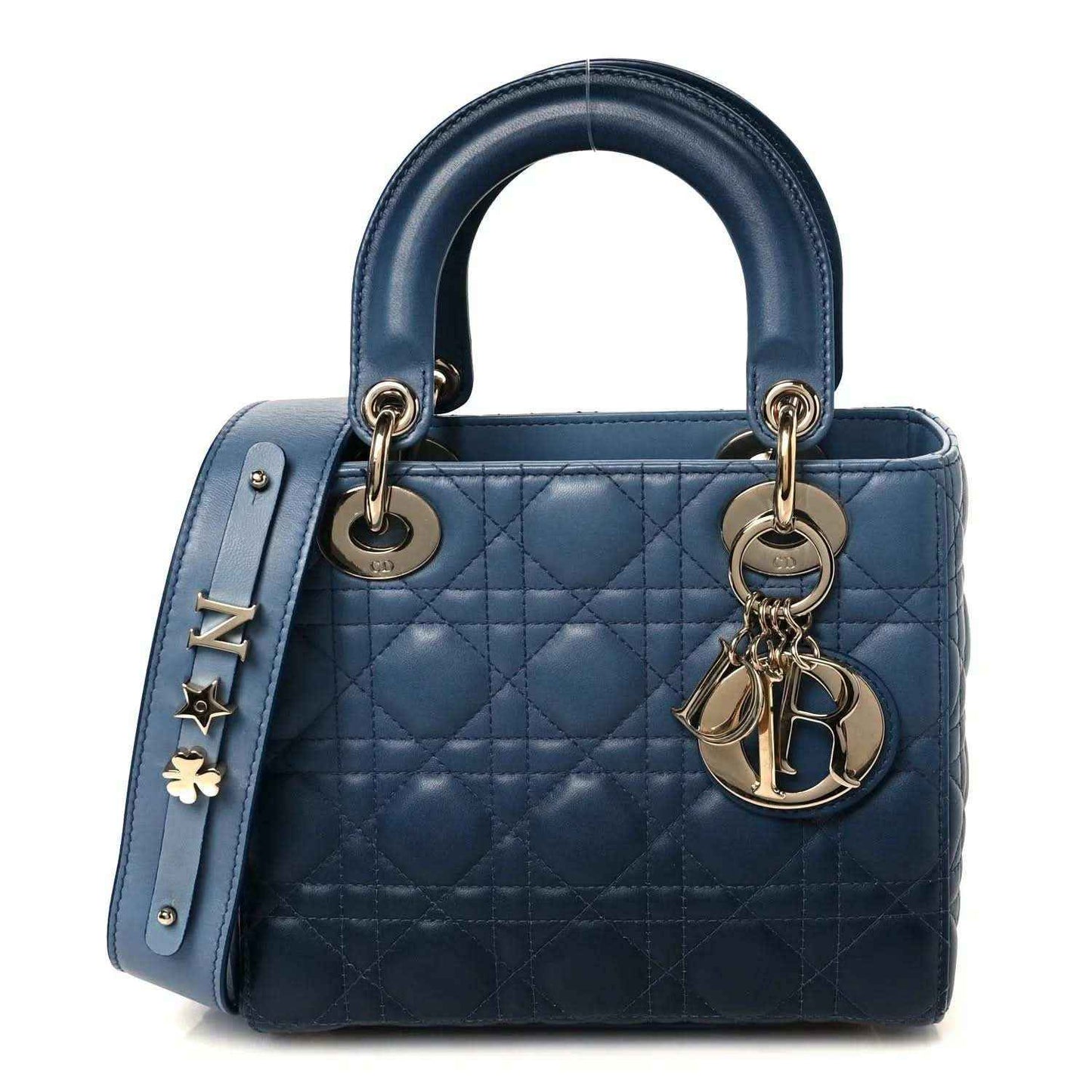 Small quilted leather handbag in indigo blue with gold-tone hardware and two top handles