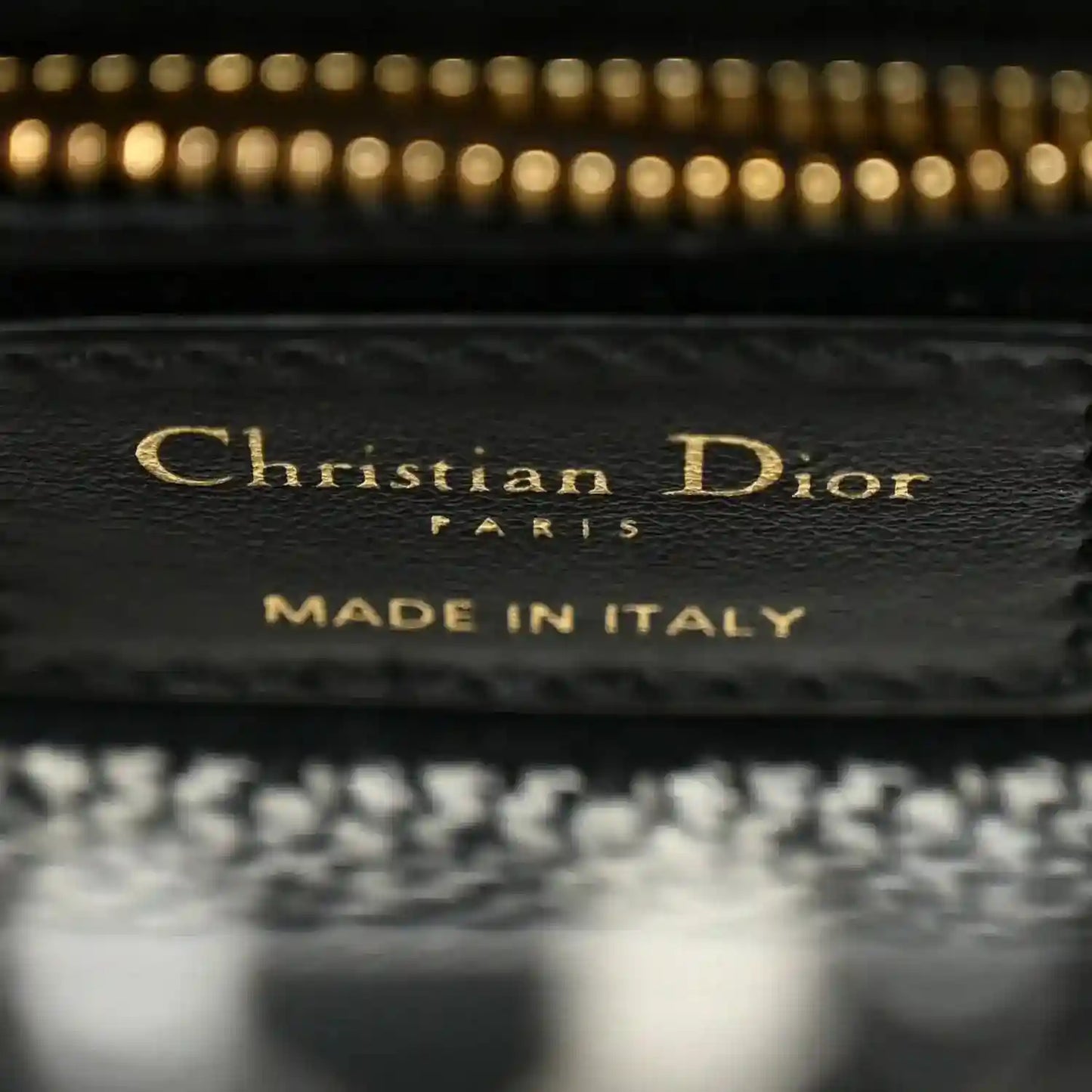 Mini canvas bag label reading Christian Dior and MADE IN ITALY on interior patch