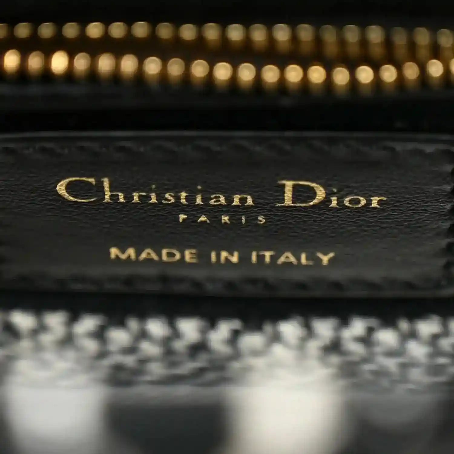 Mini canvas bag label reading Christian Dior and MADE IN ITALY on interior patch