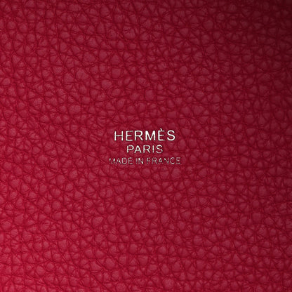 Rose pink leather bucket tote with 'HERMÈS PARIS' stamp