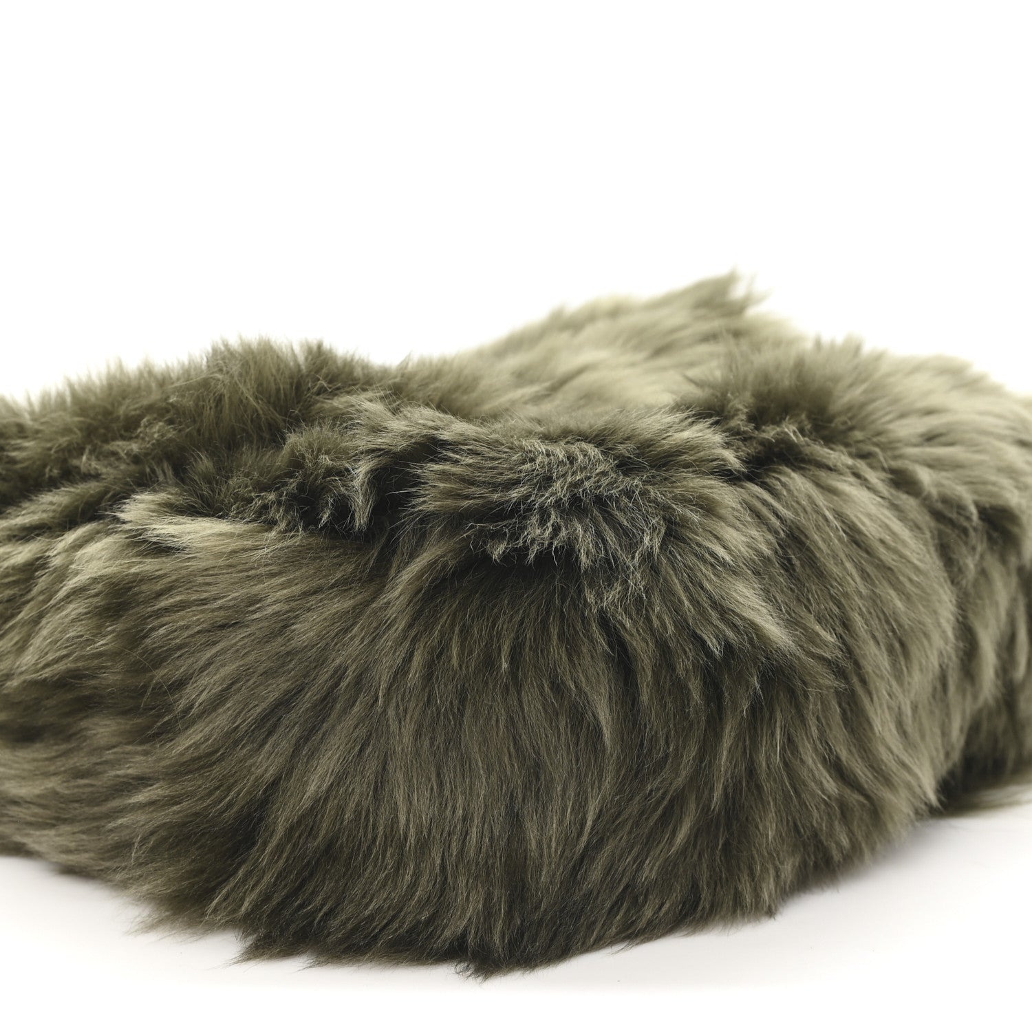 Dark olive shearling bag with dense textured fur and curved seam detail