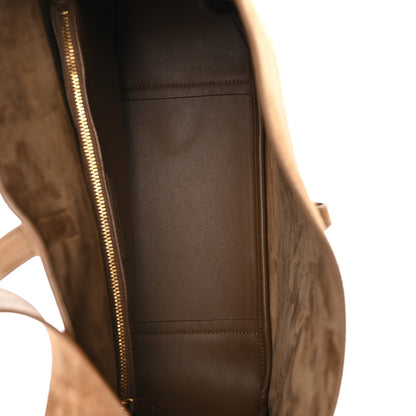 Suede hobo bag interior with gold-tone zipper and stitched lining pocket