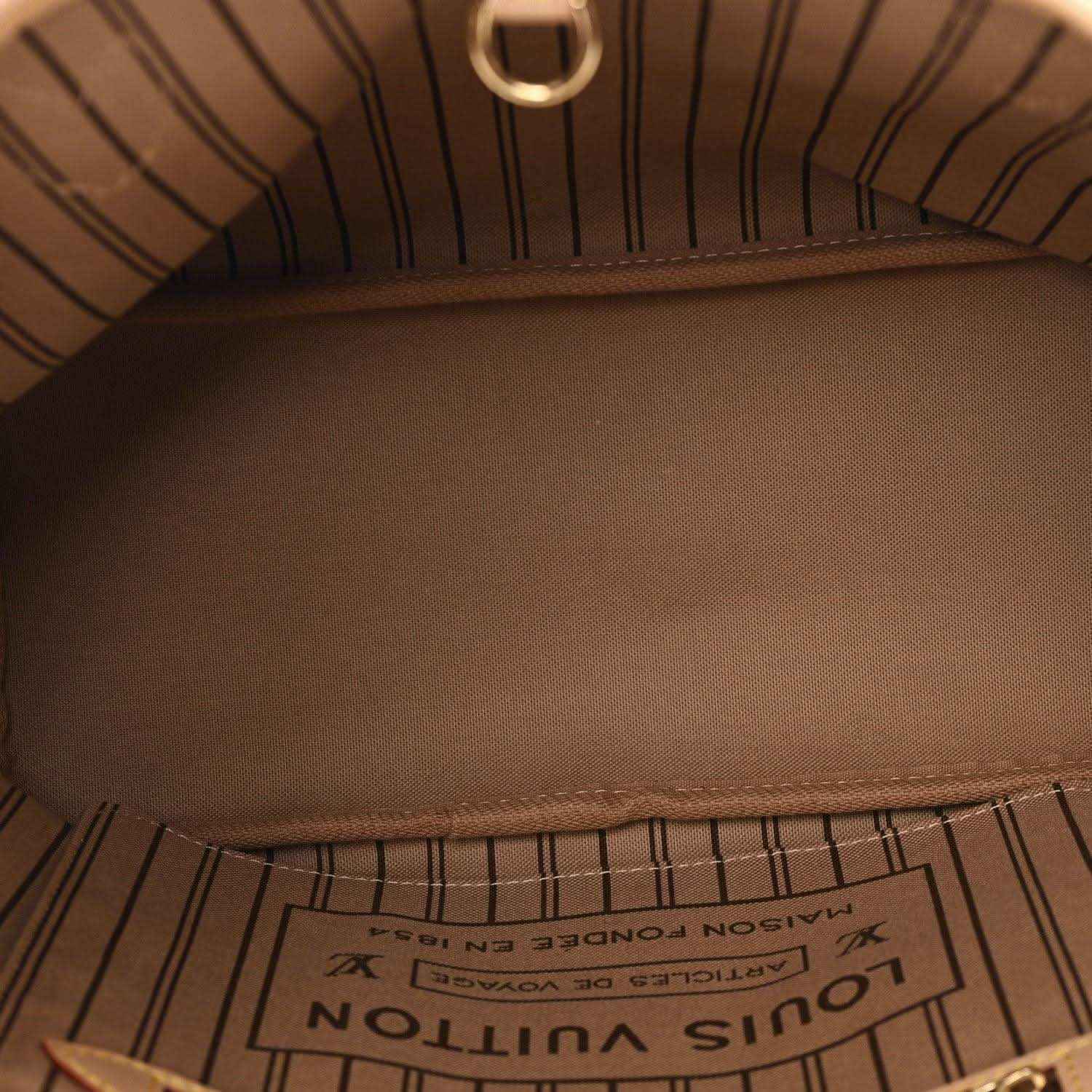 Louis Vuitton tote bag interior with stitched lining and LV label