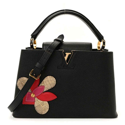 Louis Vuitton Capucines BB bag in black leather with LV emblem and flower applique