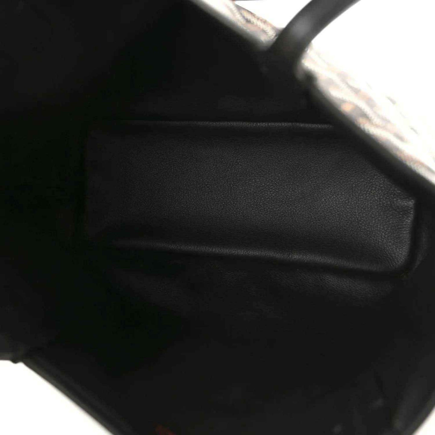 Reversible mini tote bag close-up of black leather trim and edge stitching