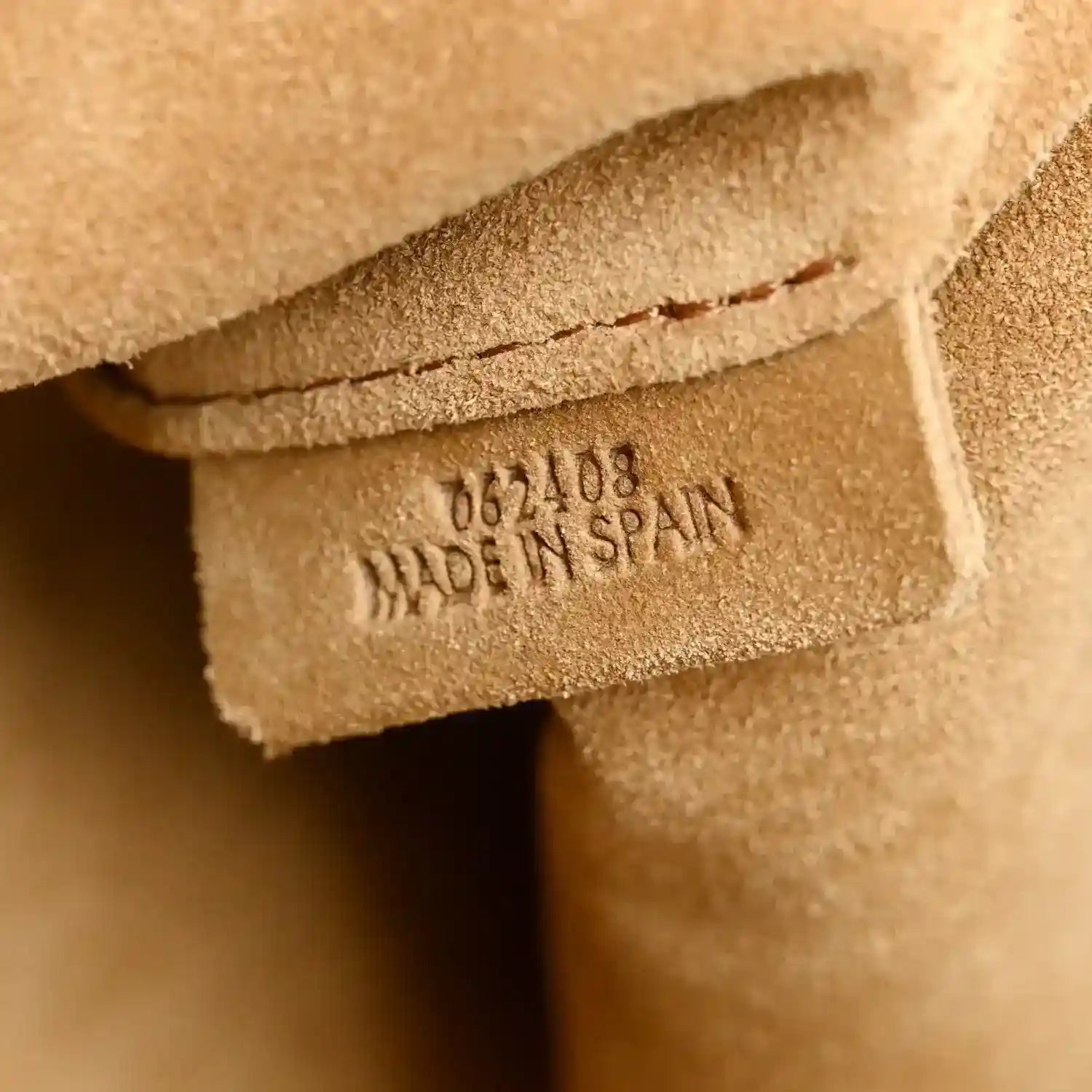 Made in Spain stamp on inner tag of Sahara nappa leather clutch