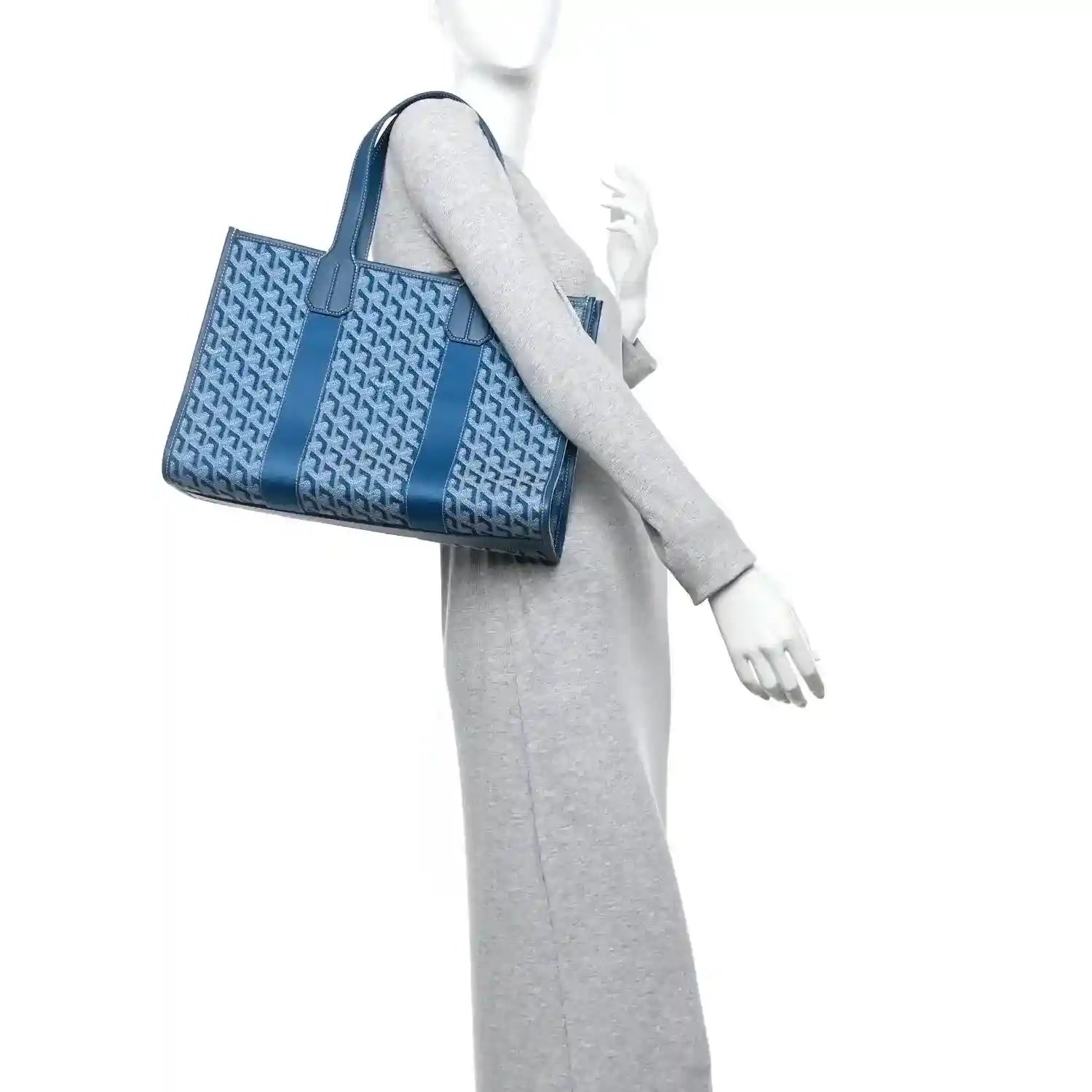 Ocean blue Villette PM tote bag worn by a model, showing side profile and top handles.