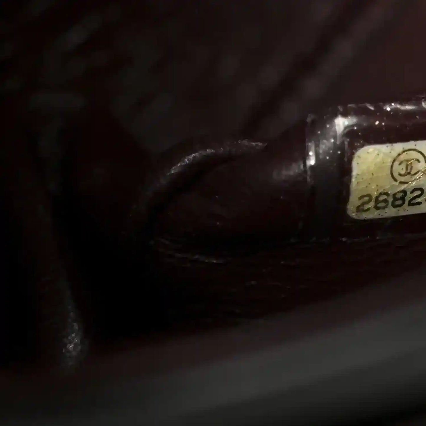 Chanel interior label with serial number on dark red leather