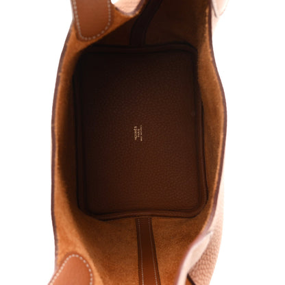 Tan leather bucket bag interior with suede lining and open top