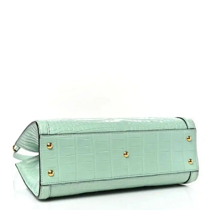 Green alligator-pattern shoulder tote bag with flap, gold buttons, and top handle