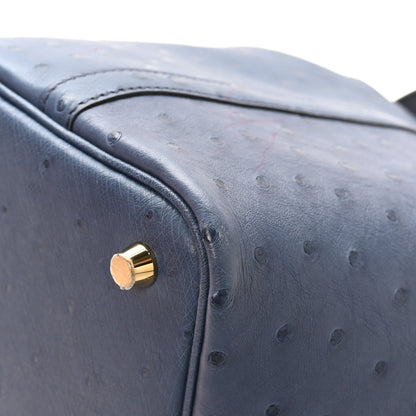Picotin Lock 18 bucket bag in blue ostrich leather with gold lock hardware