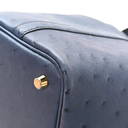 Picotin Lock 18 bucket bag in blue ostrich leather with gold lock hardware