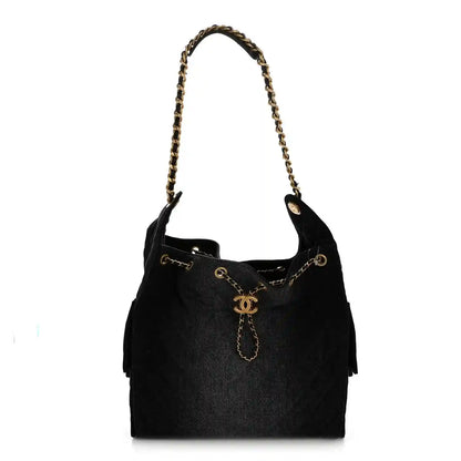 Chanel medium quilted denim shoulder bag in black, gold chain handles and CC charm