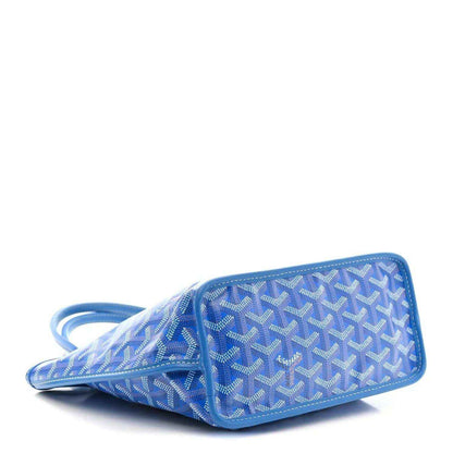 Sky blue patterned mini tote bag shown at an angle with short strap