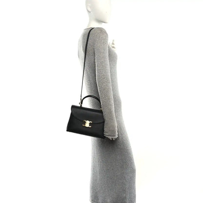 Black Celine medium shoulder bag on crossbody strap with gold-tone emblem