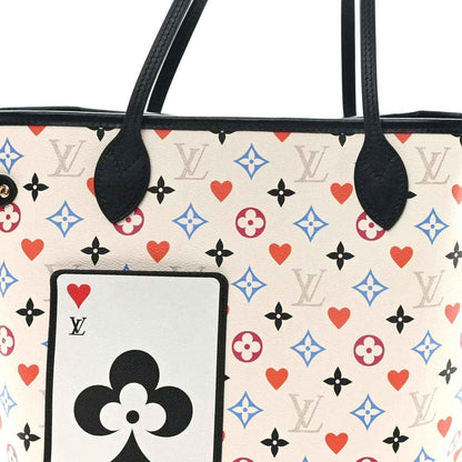 White monogram tote front patch with black flower emblem and red heart motifs