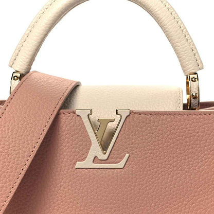 Rose leather handbag with cream trim and gold LV emblem on front
