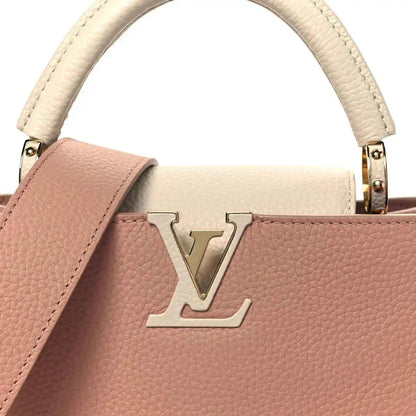 Rose leather handbag with cream trim and gold LV emblem on front
