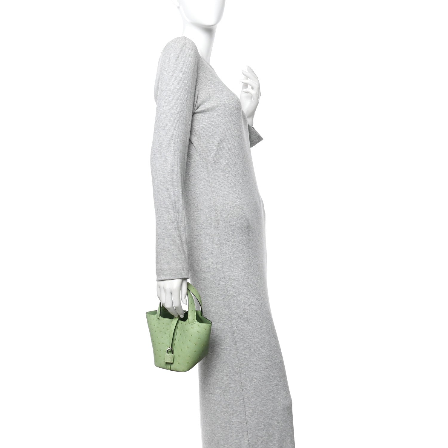 Green mini handbag worn on the shoulder with a short chain strap