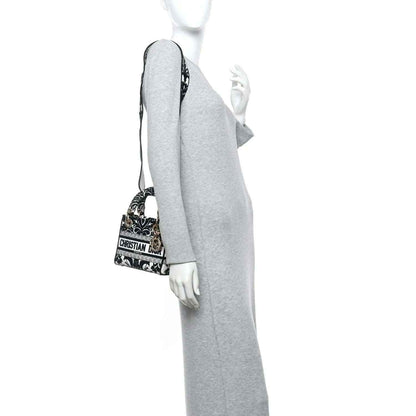 Mini embroidered canvas bag in black and white floral print with short shoulder strap