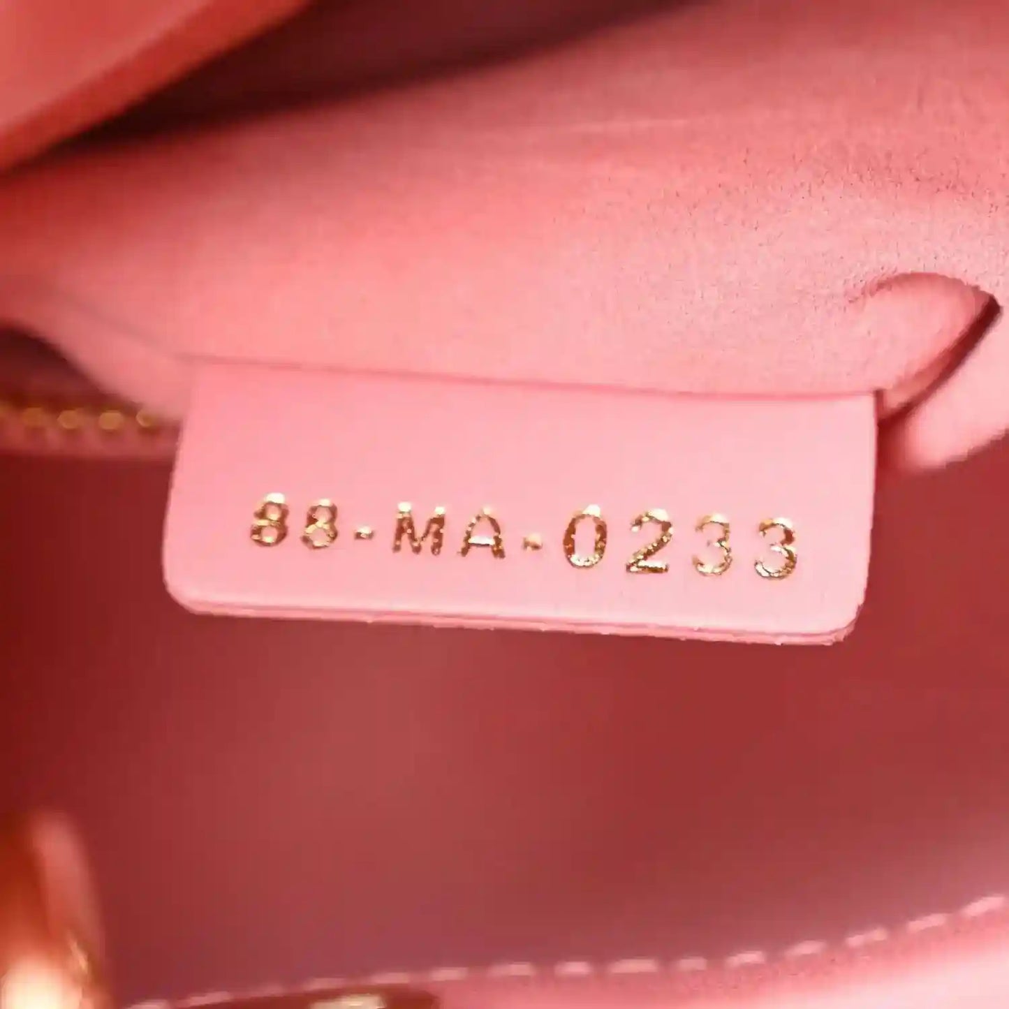 Light pink handbag tag inside with code 83-MA-0233
