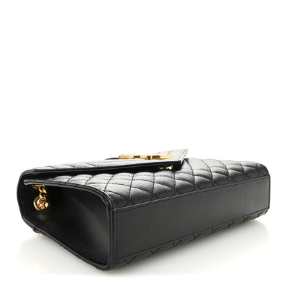 Black quilted leather satchel side view with gold-tone hardware