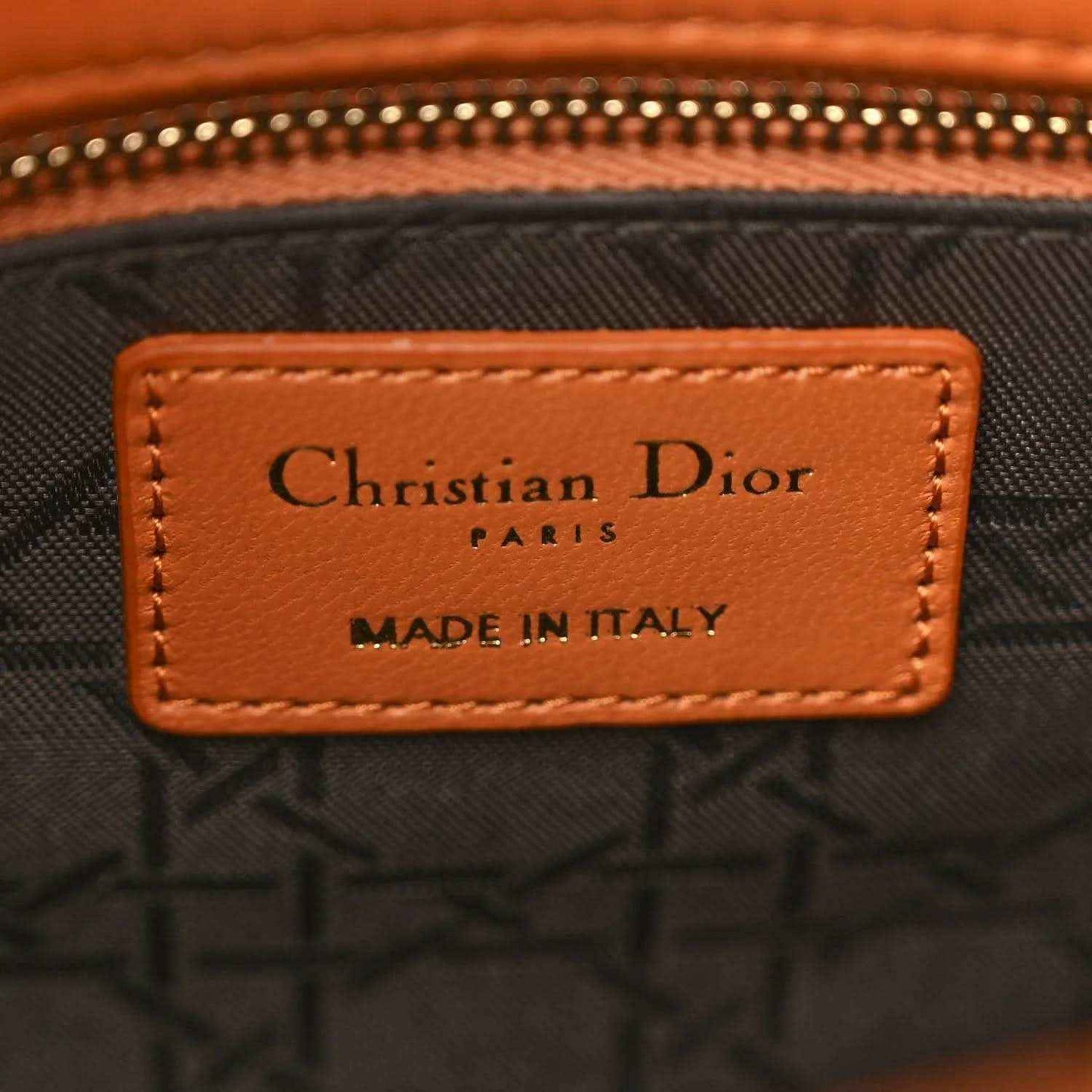 Christian Dior Paris label on inside of orange Lady Dior tote, made in Italy