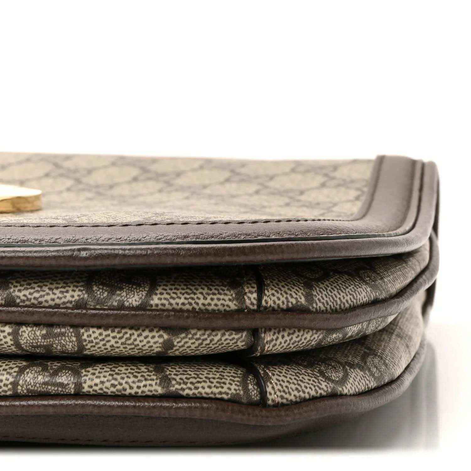 Stacked beige GG monogram canvas with brown leather edging and flap seam detail
