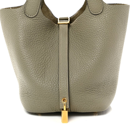 Sauge leather tote bag front view with top handle strap and centered gold lock