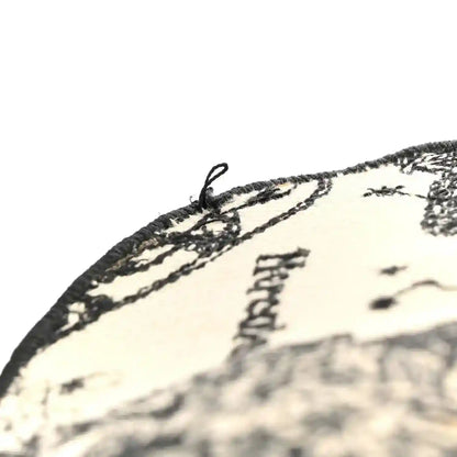 Medium handbag corner with black-and-cream toile fabric and stitched edge detail