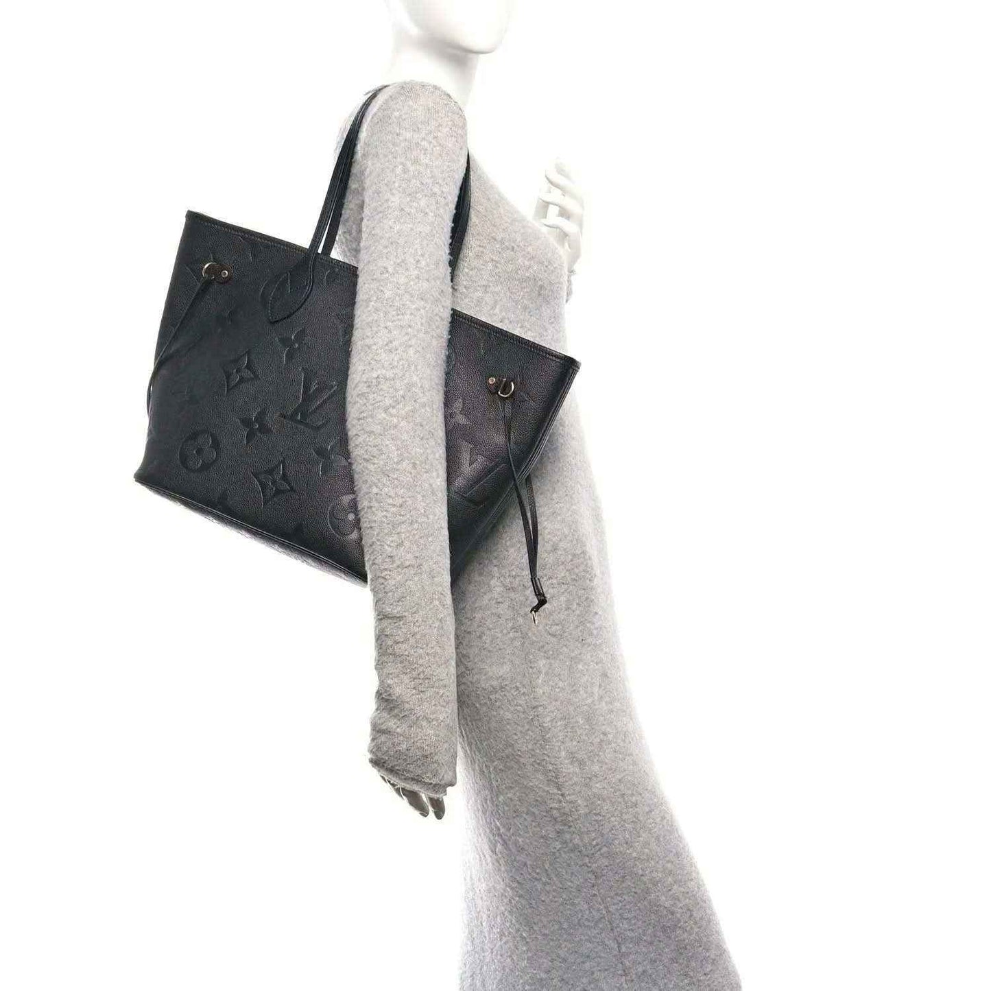Neverfull MM tote bag, dark black embossed monogram leather, side profile and straps
