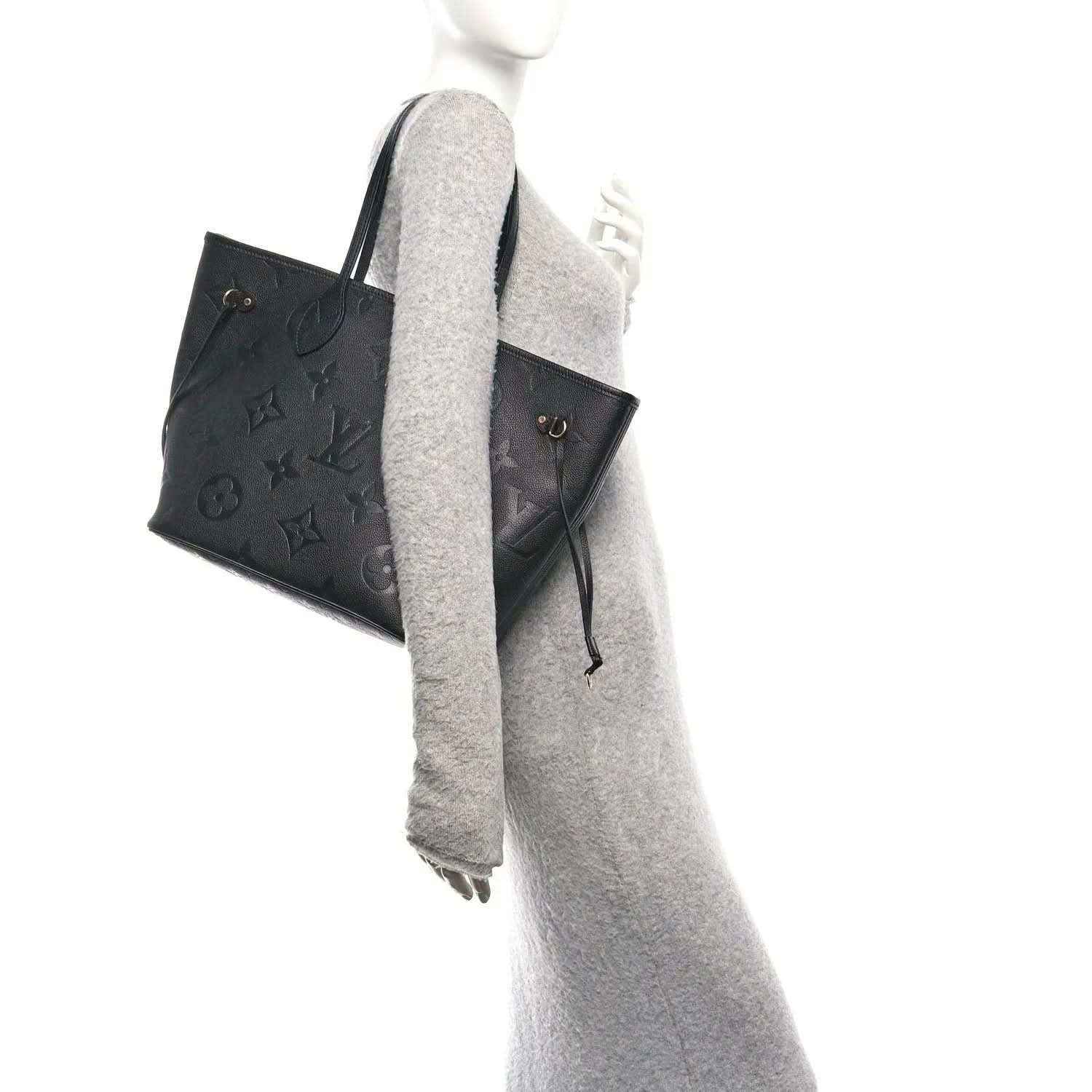 Neverfull MM tote bag, dark black embossed monogram leather, side profile and straps