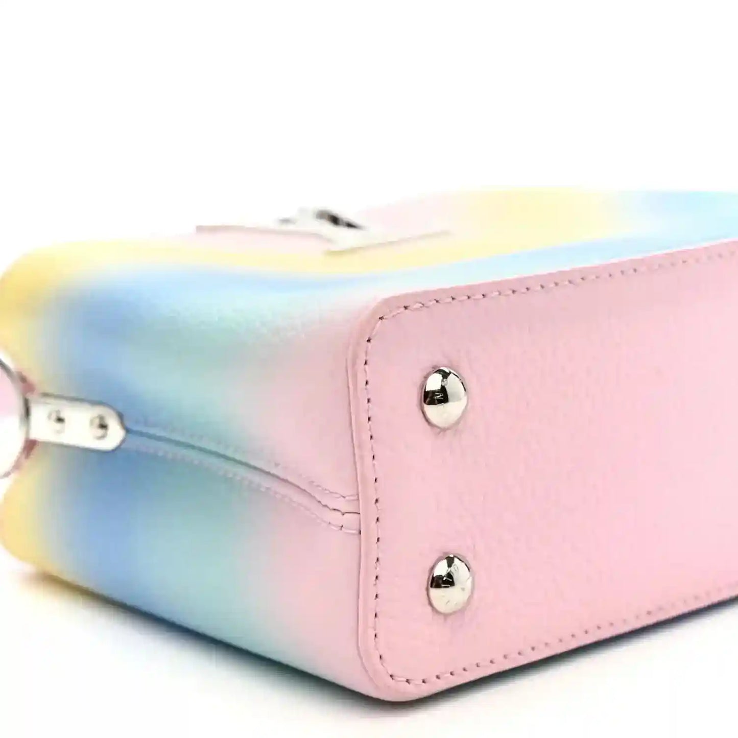 Mini Capucines bag corner with silver studs, pink leather trim and rainbow gradient body