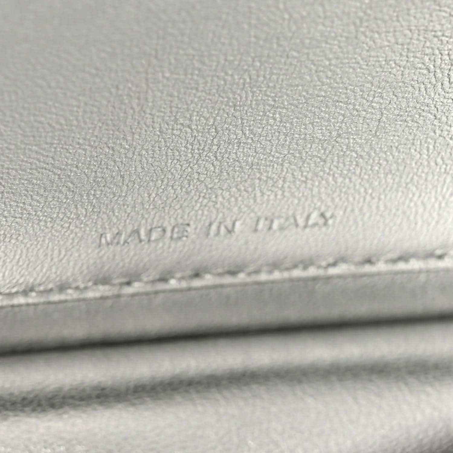 Light gray leather lining with faint stamped text near stitching