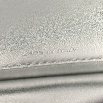 Light gray leather lining with faint stamped text near stitching