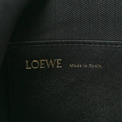 Black leather interior label with LOEWE and Made in Spain text
