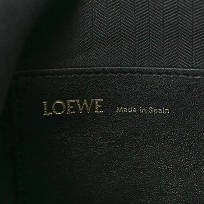 Black leather interior label with LOEWE and Made in Spain text