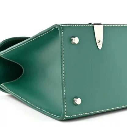 Goyard Saigon PM green canvas bag corner with snap hardware and stitched leather edges
