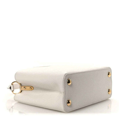 Louis Vuitton Capucines BB leather handbag with gold-tone corner studs and top handle