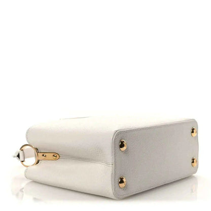 Louis Vuitton Capucines BB leather handbag with gold-tone corner studs and top handle