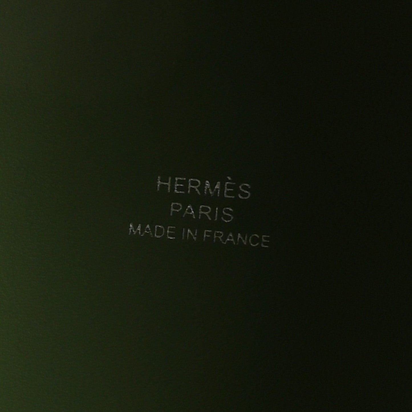 Green leather interior with embossed text reading PARIS and MADE IN FRANCE