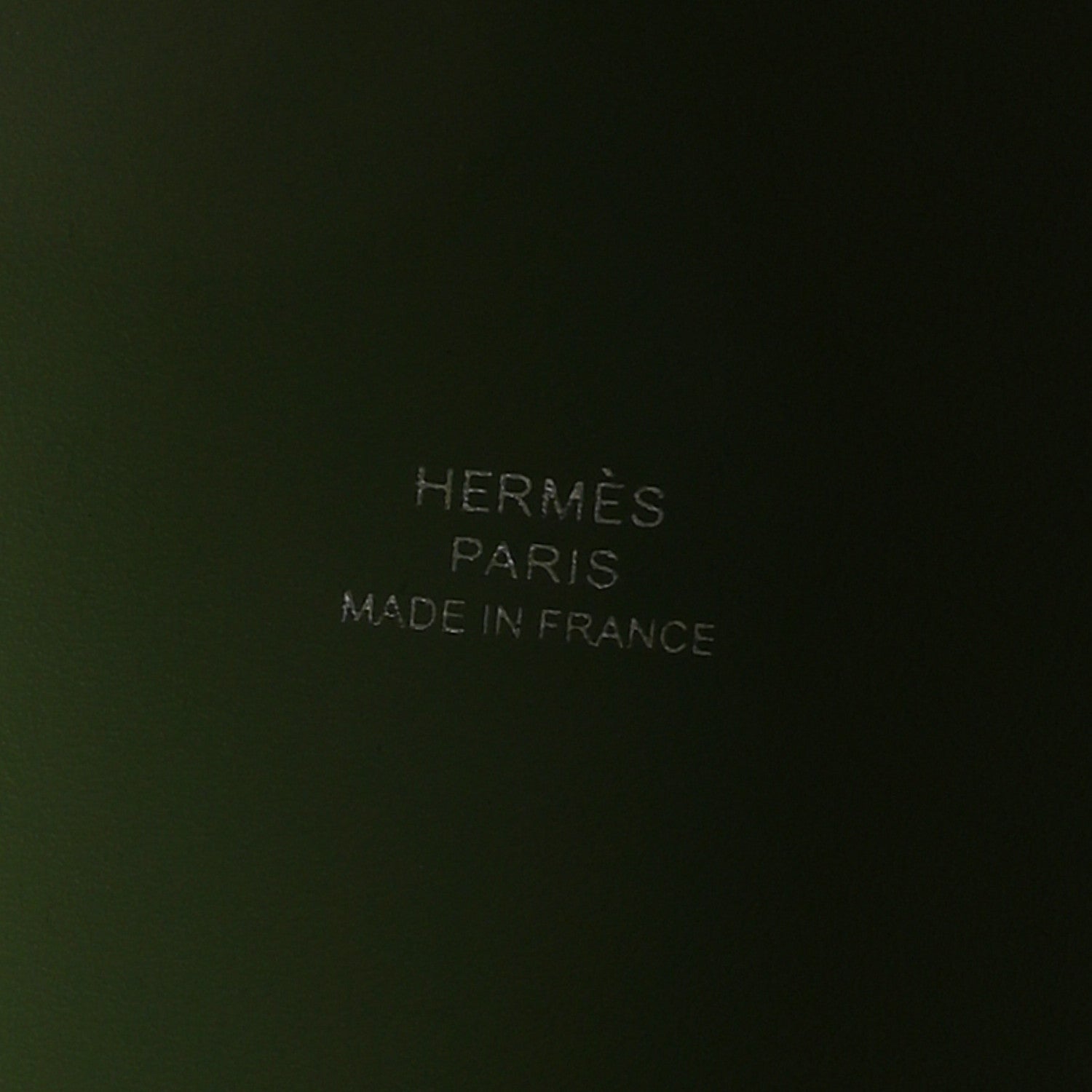 Green leather interior with embossed text reading PARIS and MADE IN FRANCE